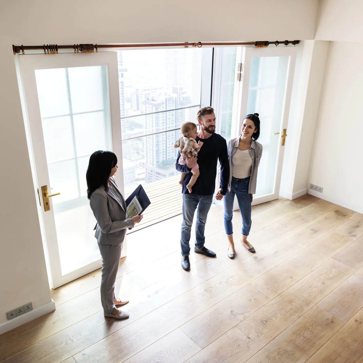 Young Family Looking at Condos