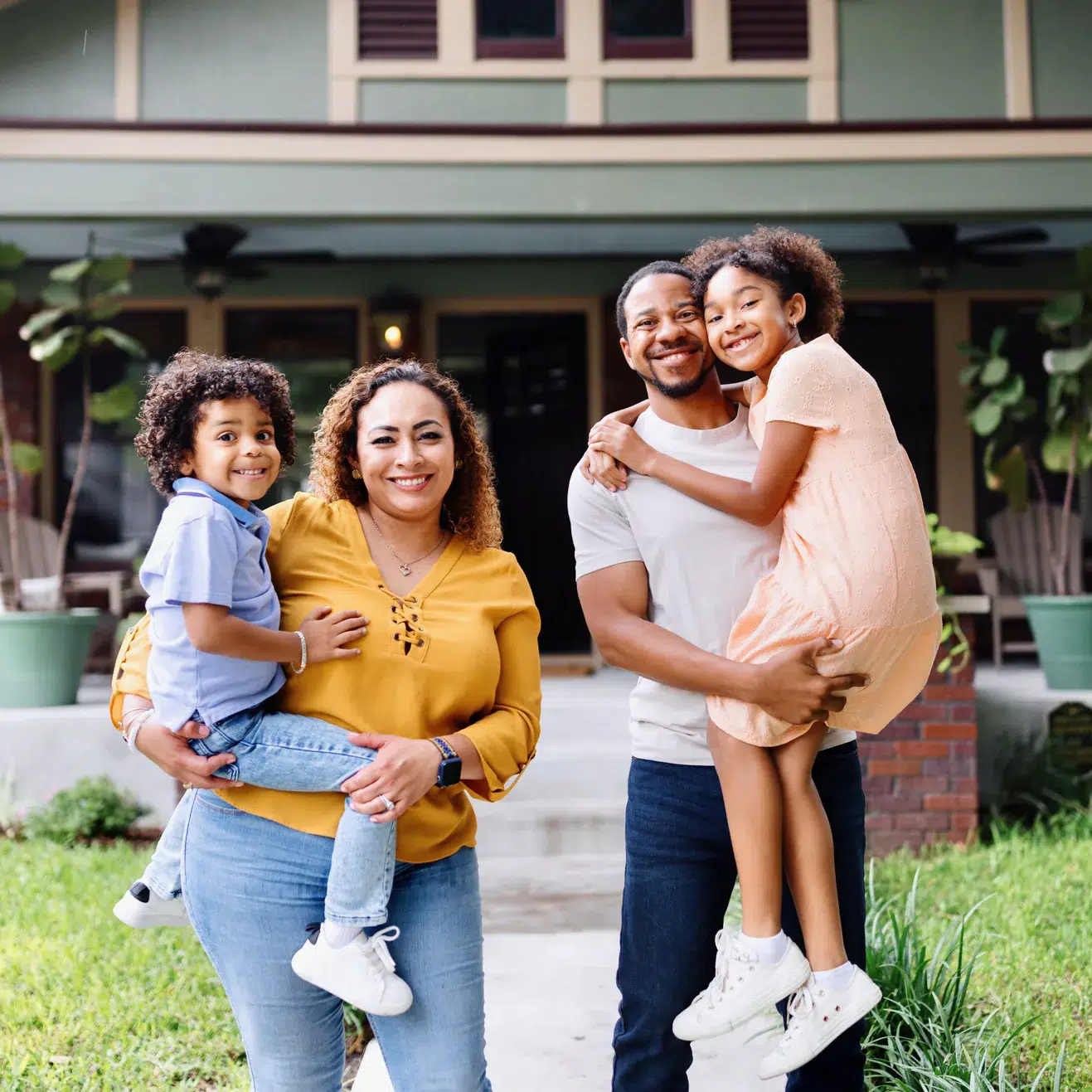 Young Family in Front of a House
