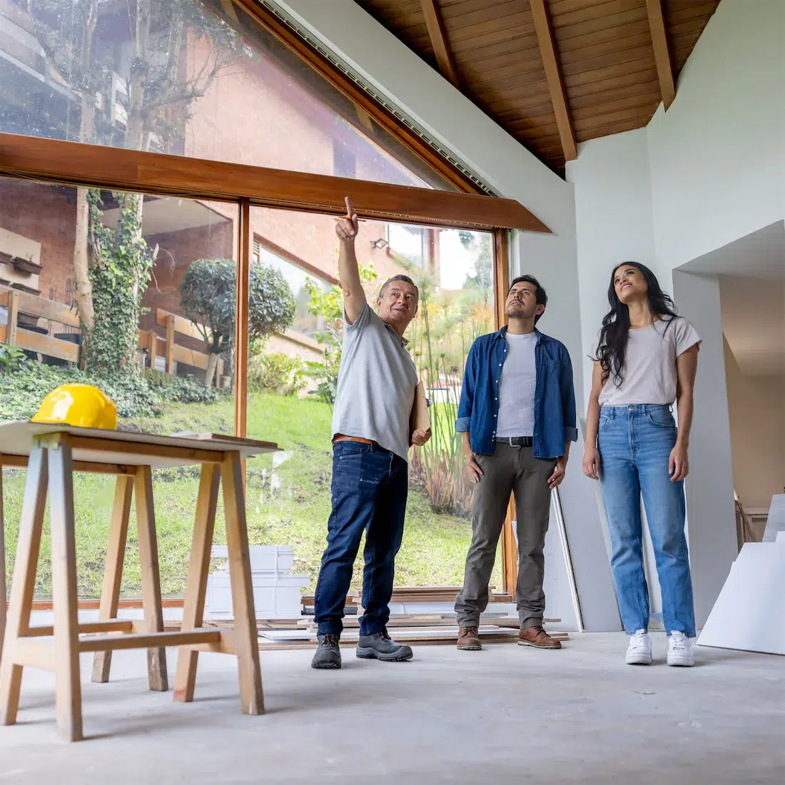 a contractor points out a feature of the home