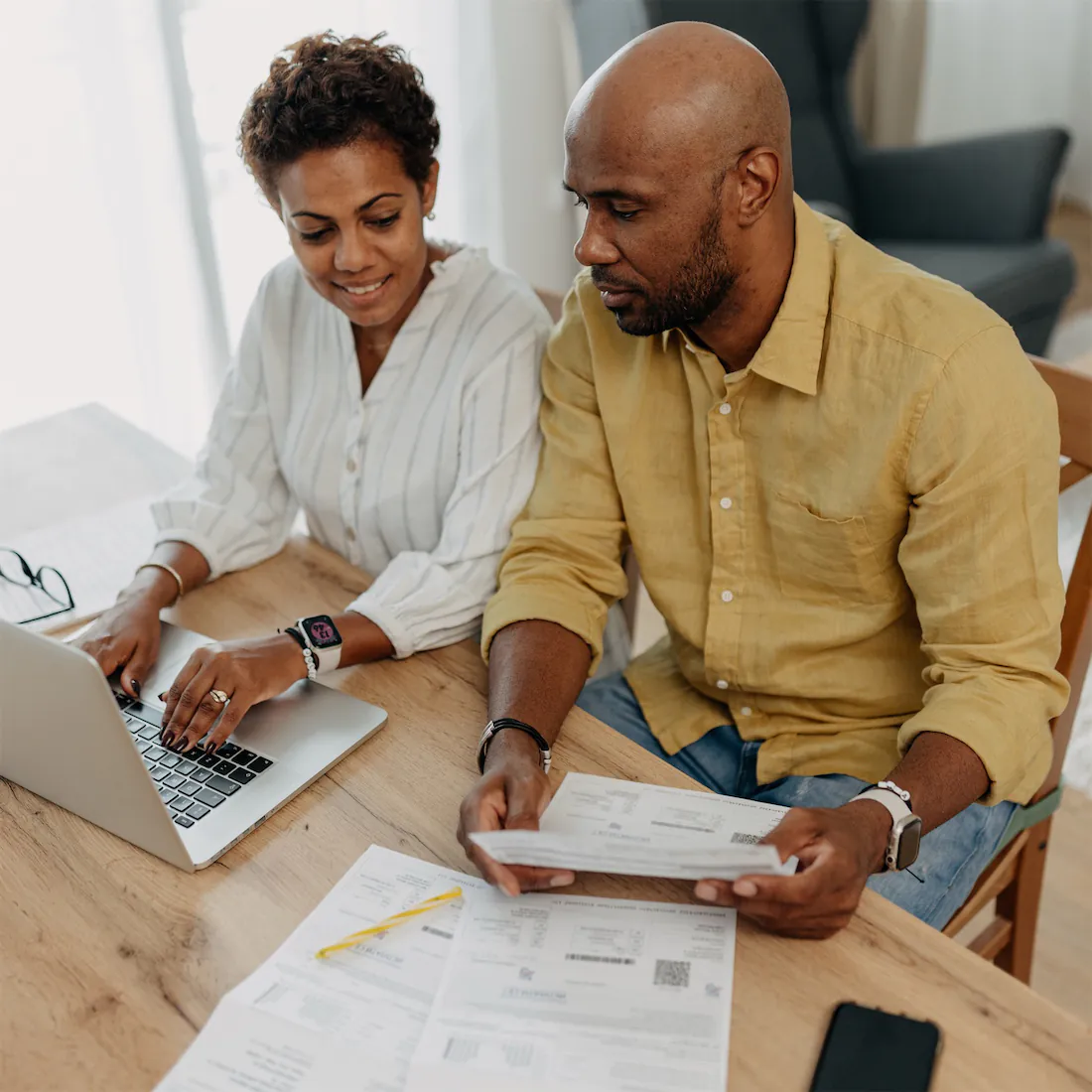 a couple reviews their finances