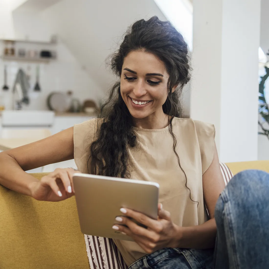 a young woman uses a tablet