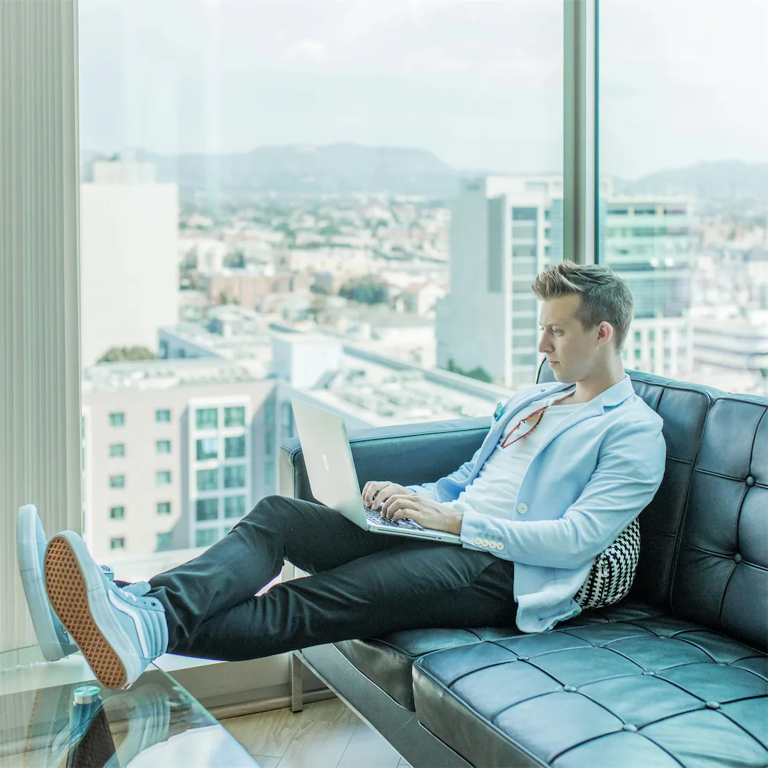 man on Laptop in Condo